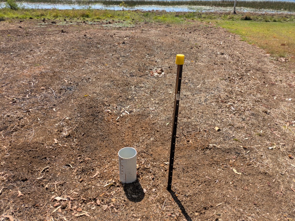 Western easement potable isolation valve — PVC sleeve and yellow-capped T-post