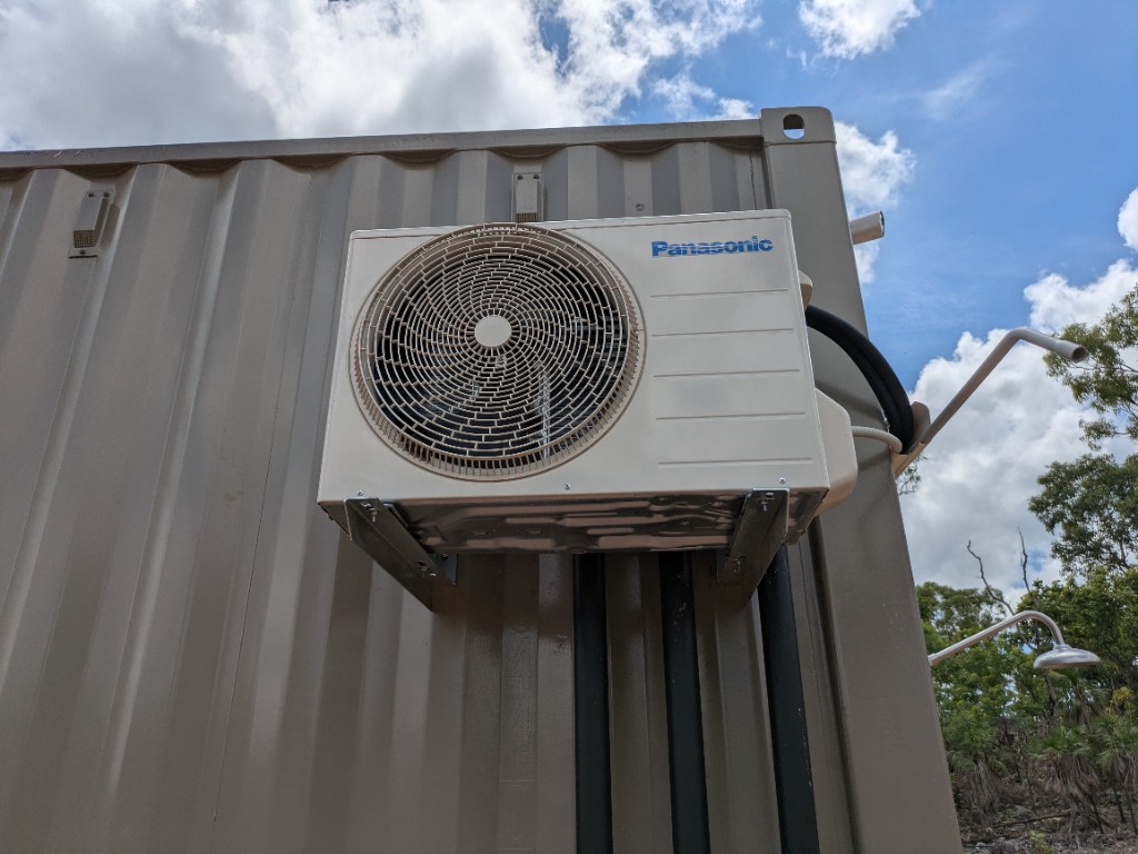 Panasonic outdoor air-conditioning unit on the WWTP control-room container