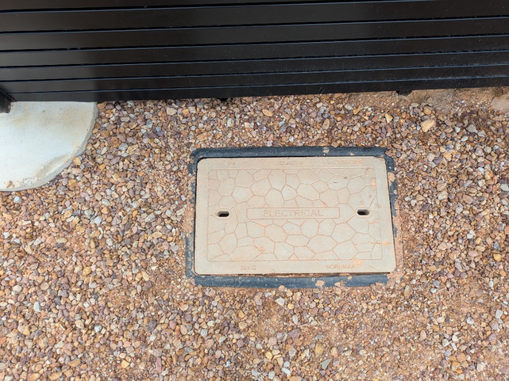 Electrical pit cover behind the WWTP control room